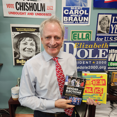 Richard Fox holding books